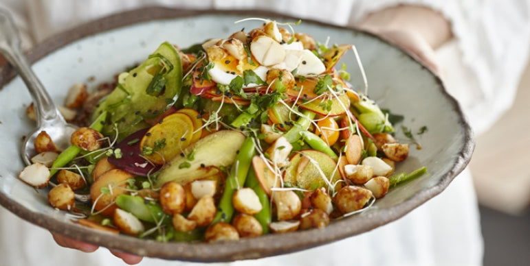 a warm salad of asparagus, fresh greens and asian herbs with cous cous and brown rice