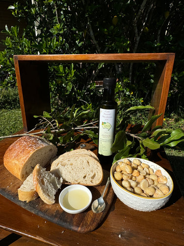 Oil, macadamias ands bread board