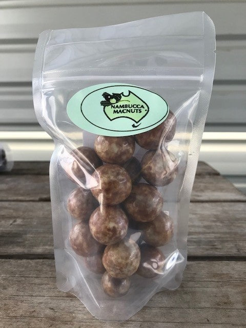 More moon chocolates. Delicious macadamias wrapped in white and milk chocolate with a mottled effect that reminds us of the moon - Macnuts