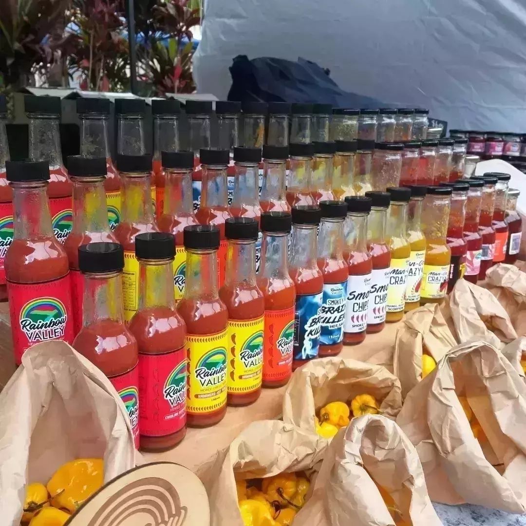 Rows and rows of Rainbow valley  products at a market stall. It's hard to beleive there's enough hours in the day to make so many mouth-watering sauces - Macnuts