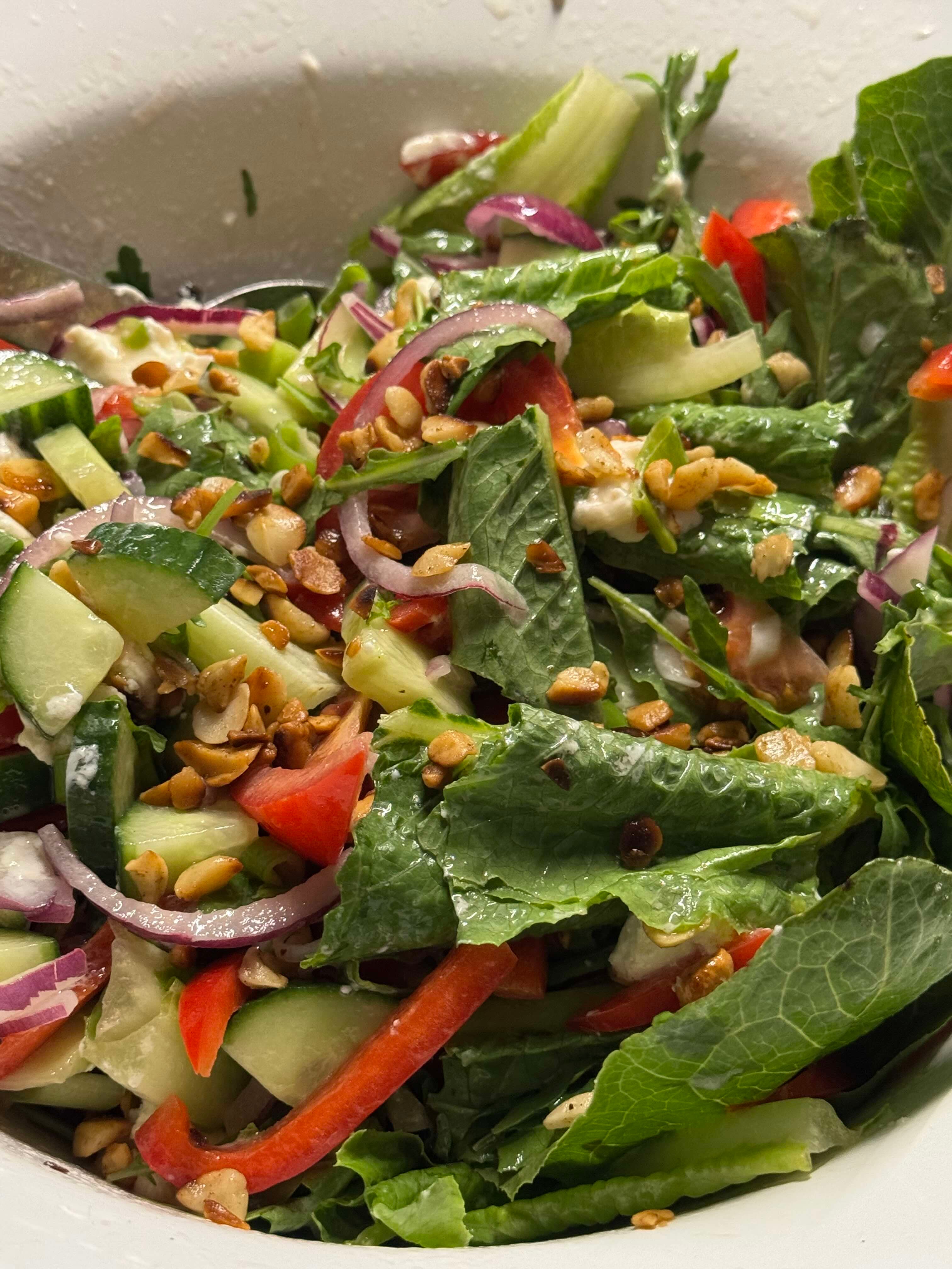 a garden salad with organic macadamia oil and citrus dressing
